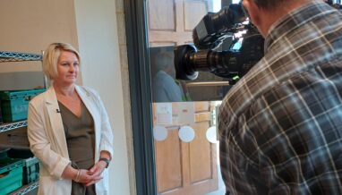 woman being interviewed on camera