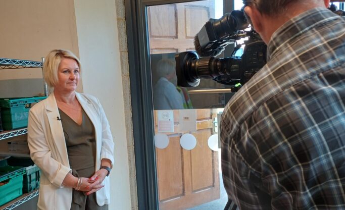 woman being interviewed on camera